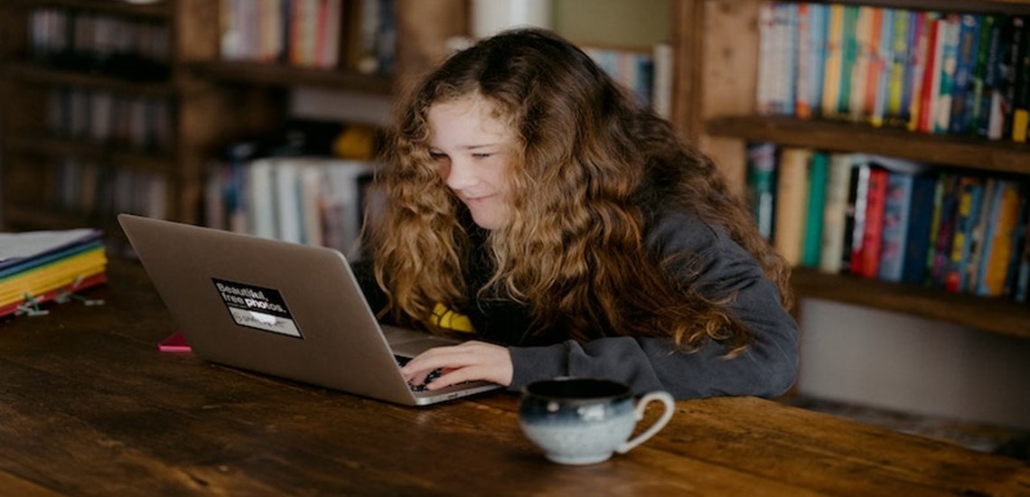 young woman working on a laptop